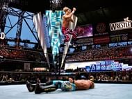 HBK in mid-air performing his signature elbow drop!